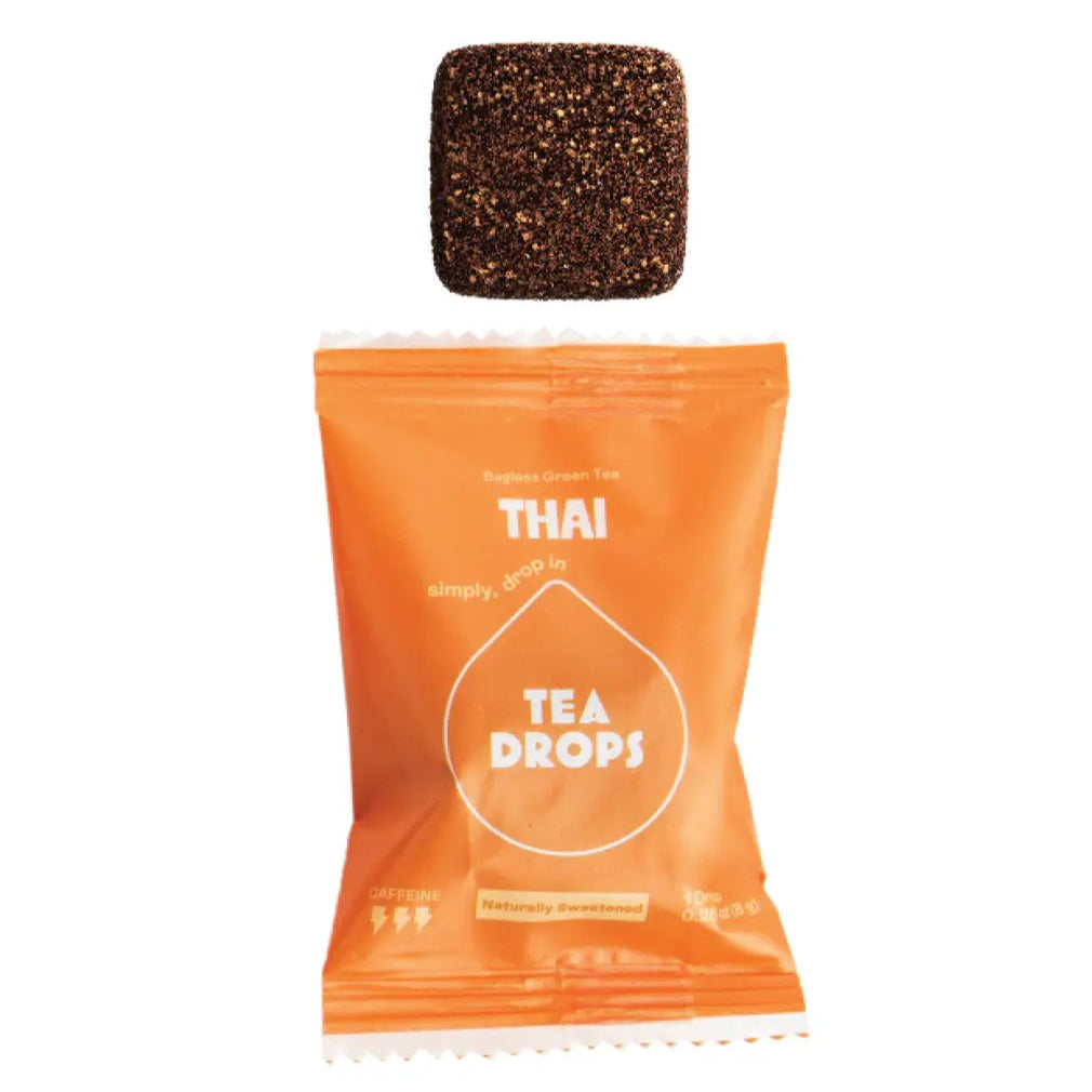 Orange package of Thai Tea Drops with a tea bag on a white background