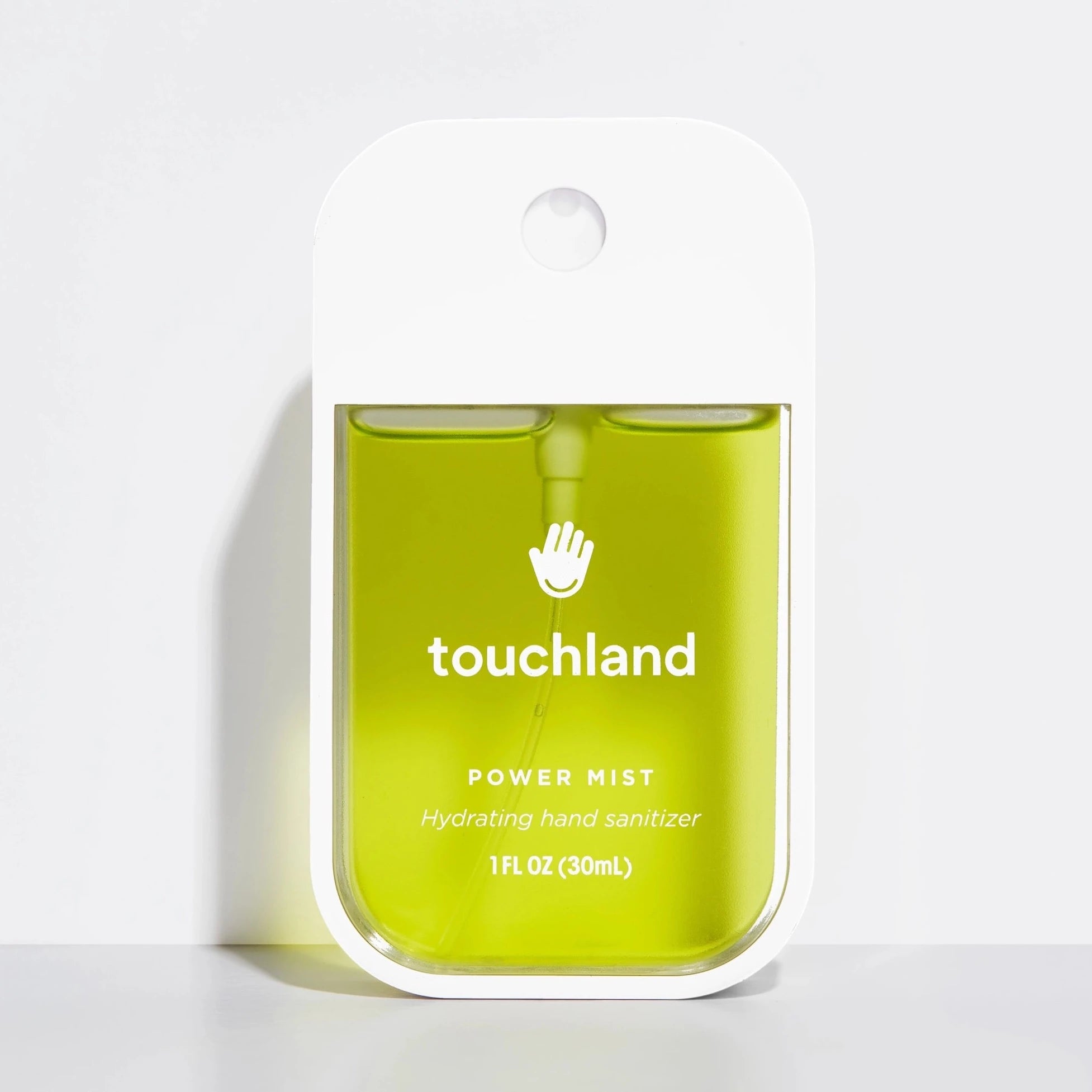 white hand sanitizer with green liquid 