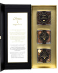 Chopin Sugafina chocolate gift set in an open black and gold presentation box, showing a printed insert card on the left and three small jars of chocolates on the right.