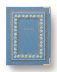 Blue album with floral embroidery on a white background
