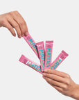 pink matcha packets with turquoise writing