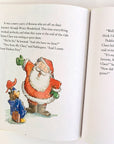 inside paddington christmas book with illustration of paddington bear talking to santa