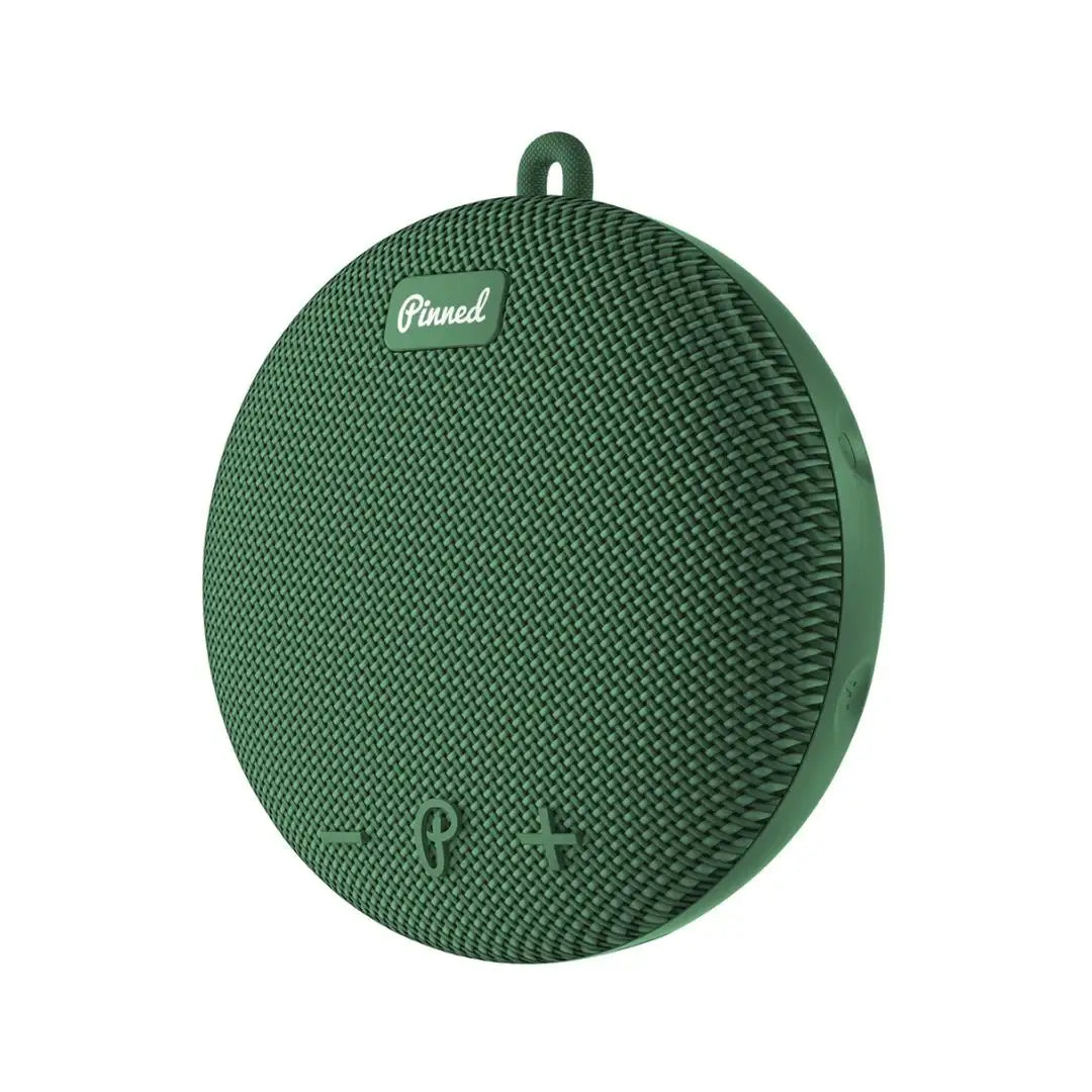 Green textured portable speaker with 'Pinned' branding on a white background