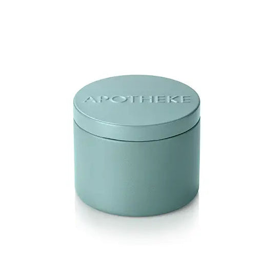 Small teal container with a lid on a white background