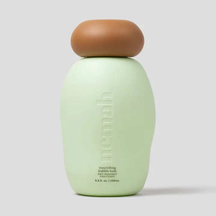 Green bottle with brown cap on a white background