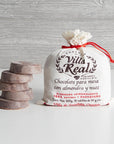Villa Real chocolate packaging with stacked chocolate pieces on a wooden background