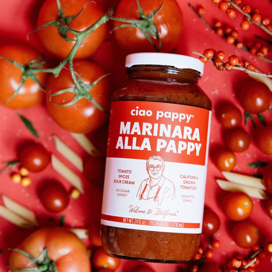 marinara sauce bottle surrounded by tomatoes