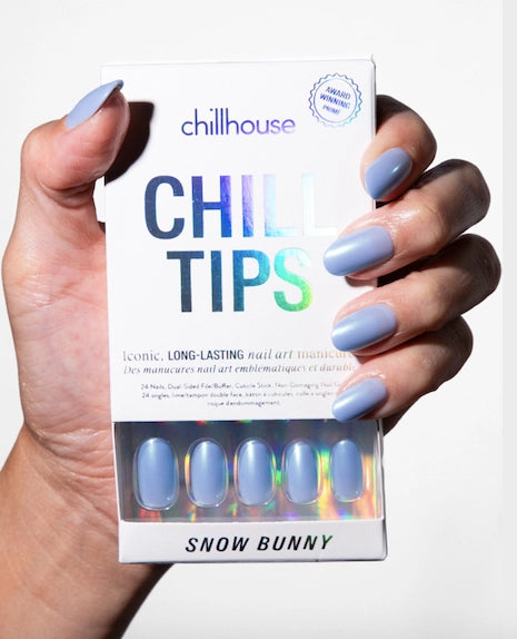 Hand holding a box of 'Chill Tips' with blue nail art, featuring the brand 'Chillhouse'.