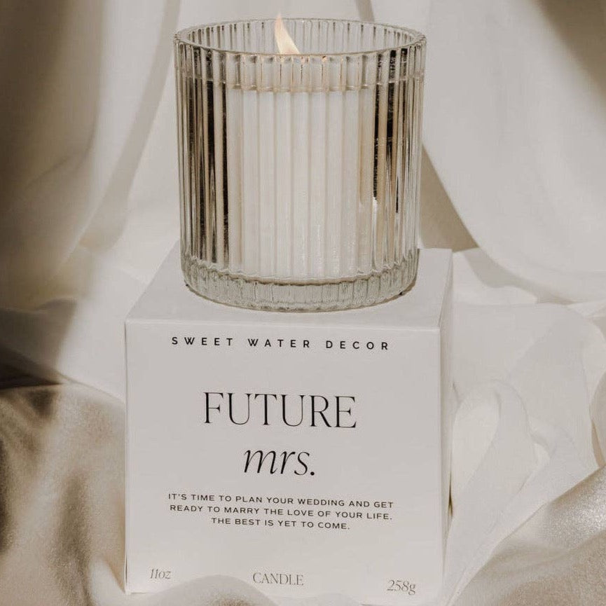 ribbed glass candle on top of box that says 'FUTURE MRS.'