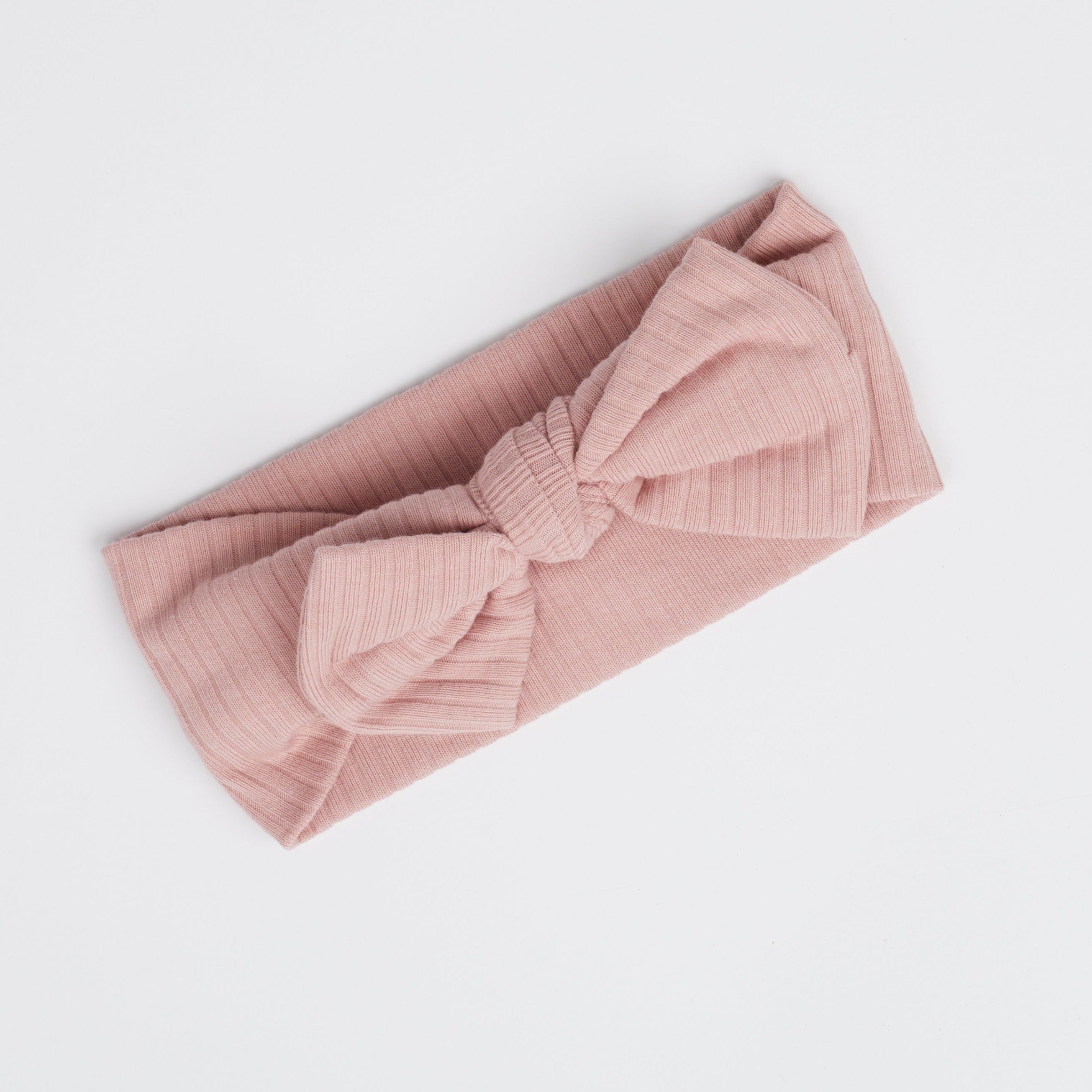 The Blair Pink Baby Bow Headband against a white background.