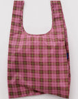 Pink and green plaid reusable bag on a white background