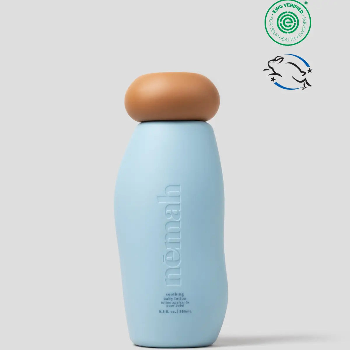 Blue bottle with brown cap on a light gray background