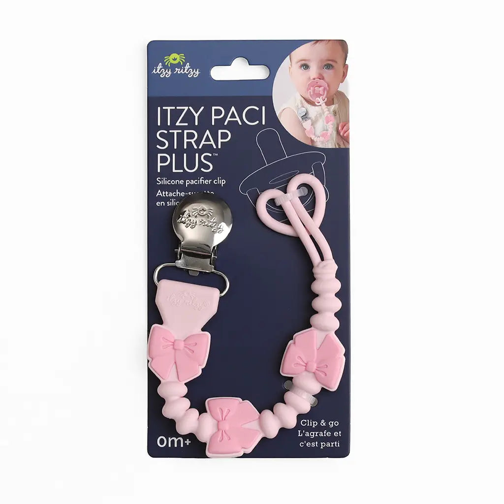 itzy bow pacifier holder on blue packaging