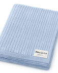 Light blue folded towel with Bleu-La-La label on a white background