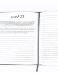 Open notebook with lined pages on a white background