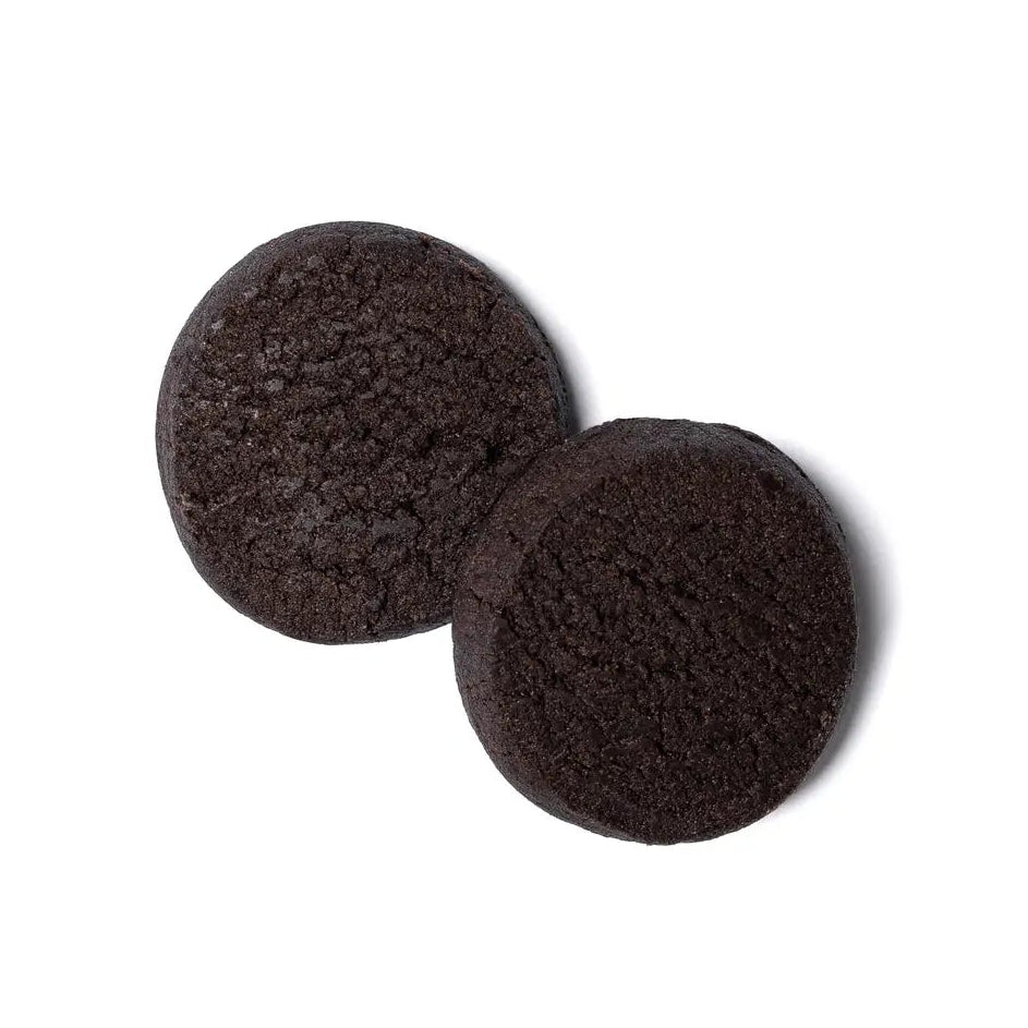 Two dark brown circular felt pads on a white background