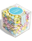 Cube of colorful chocolate confetti with a visible brand label on a white background