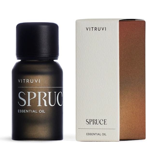 Vitruvi Spruce essential oil bottle and packaging on a white background