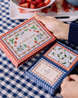 rifle paper co picnic playing cards on a blue gingham tablecloth