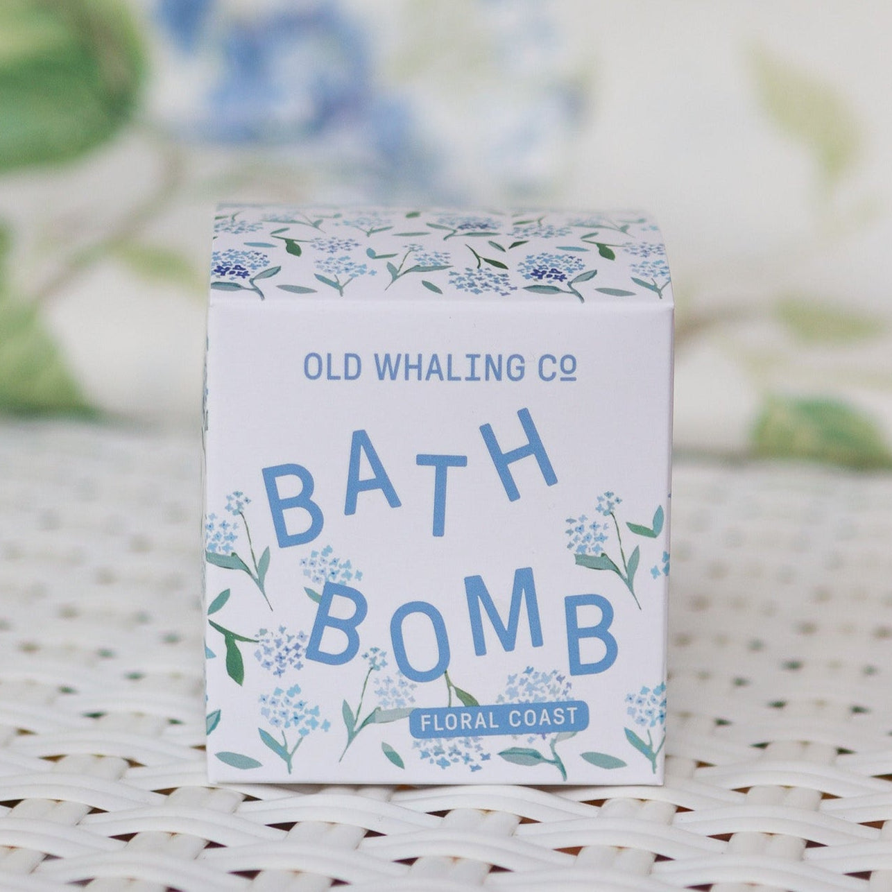 white bath bomb box with blue hydrangeas on it