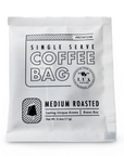 A single-serve coffee bag in a white resealable pouch with black text reading 'Single Serve Coffee Bag' and 'Medium Roasted' on a clean white background.