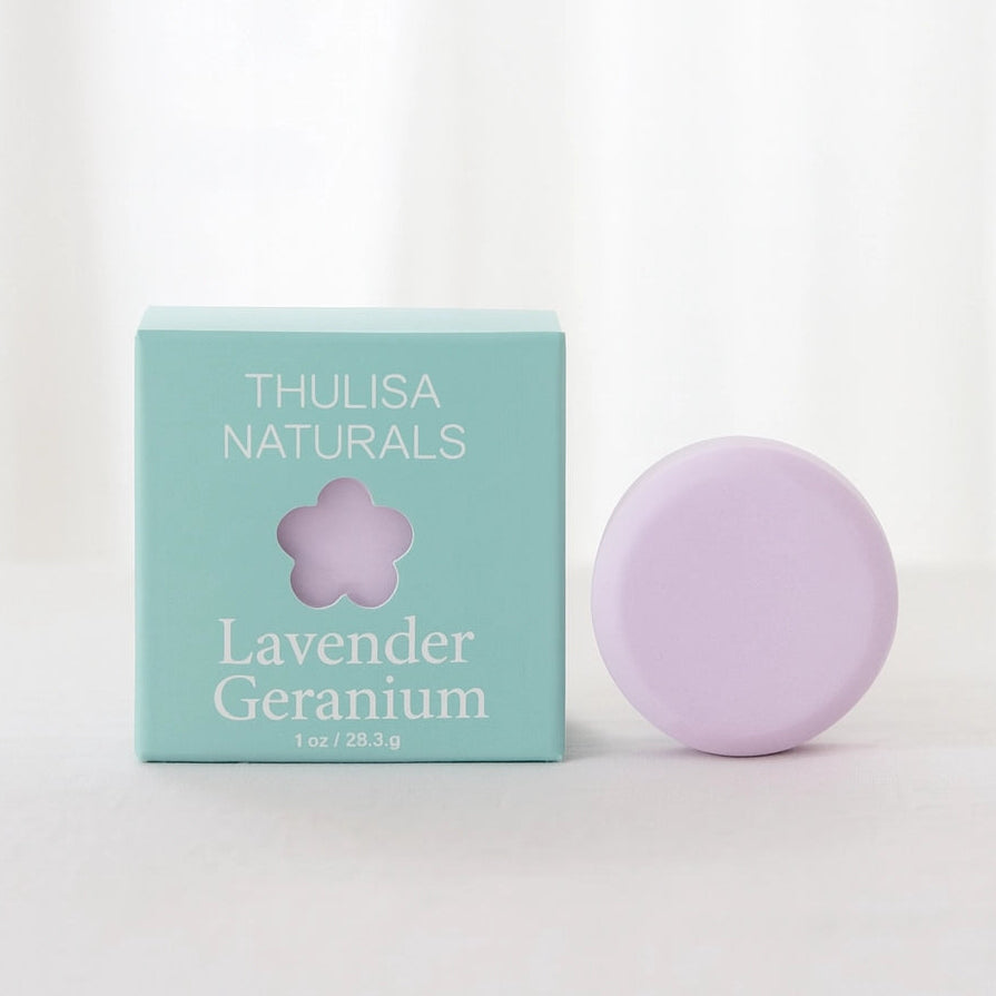 Lavender soap bar and packaging with 'Thulisa Naturals' branding on a white background