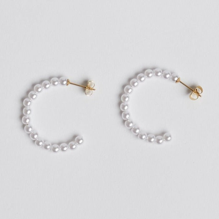 Pearl hoop earrings on white