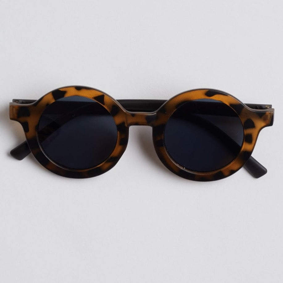 Brown baby tortoise shell sunglasses on white