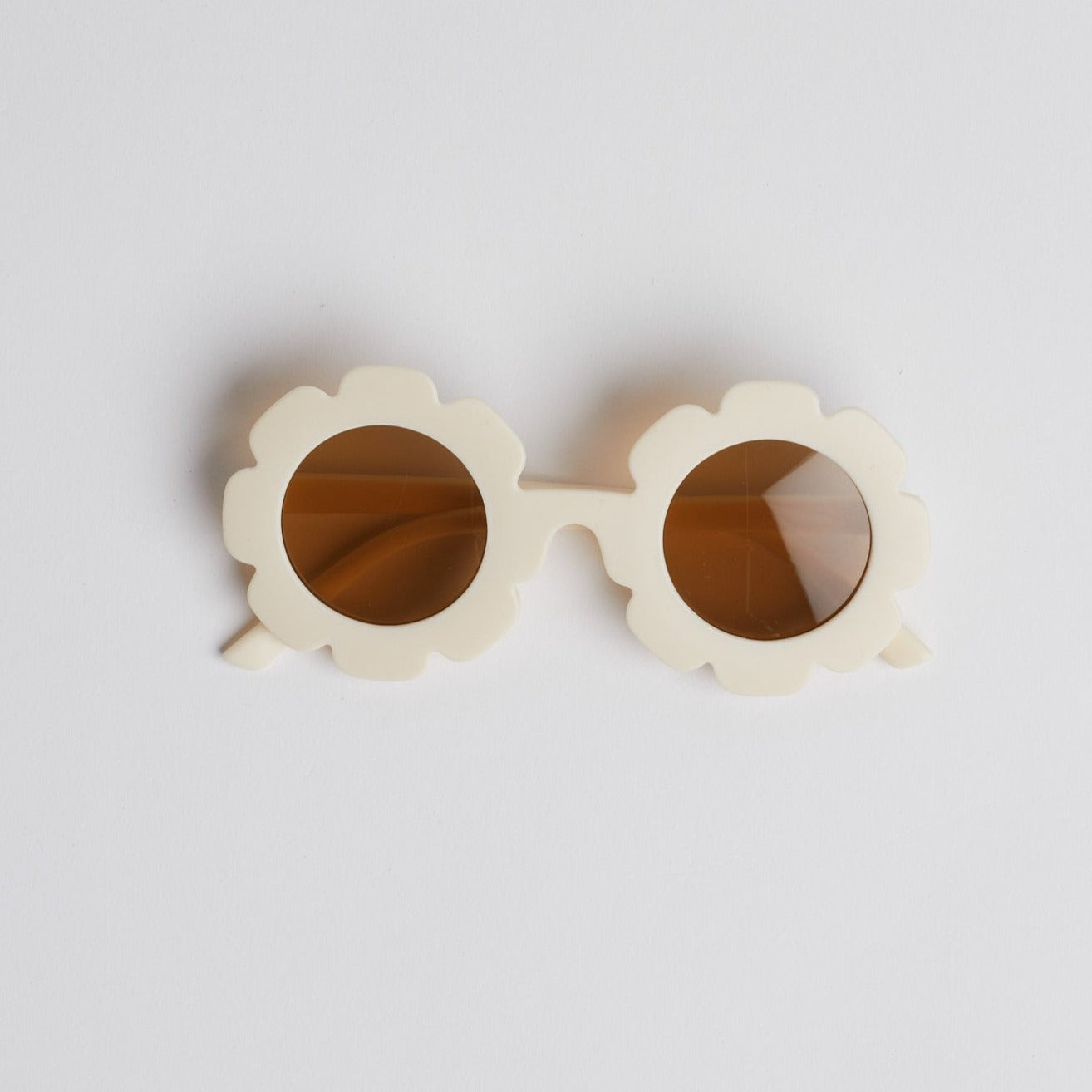 Beige floral baby sunglasses on white