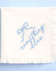 White towel with blue text 'Something Blue' on a light blue background