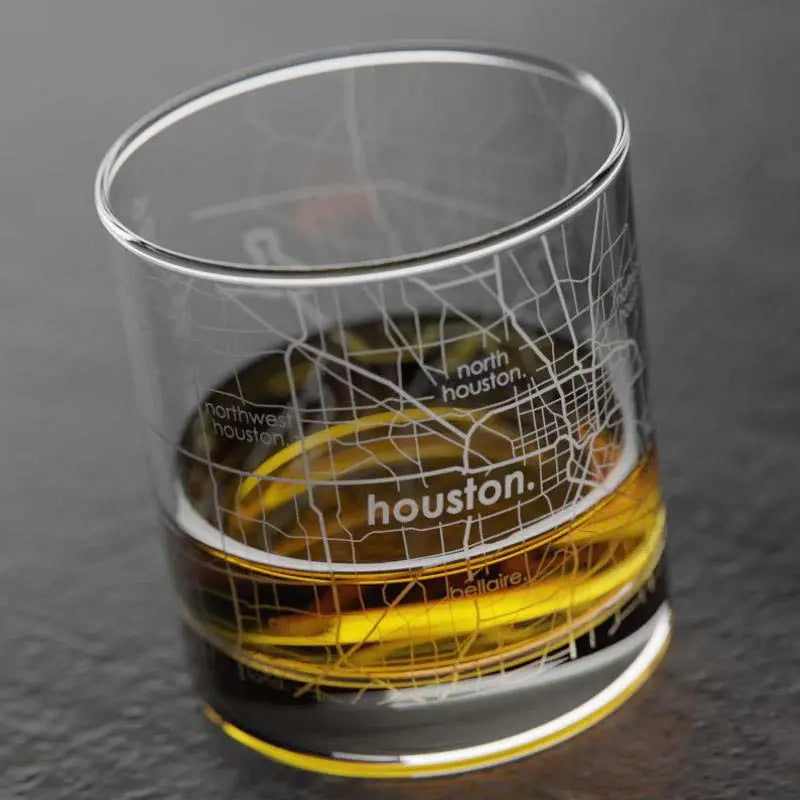 Glass with a Houston map design on a dark background