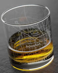 Glass with a Houston map design on a dark background