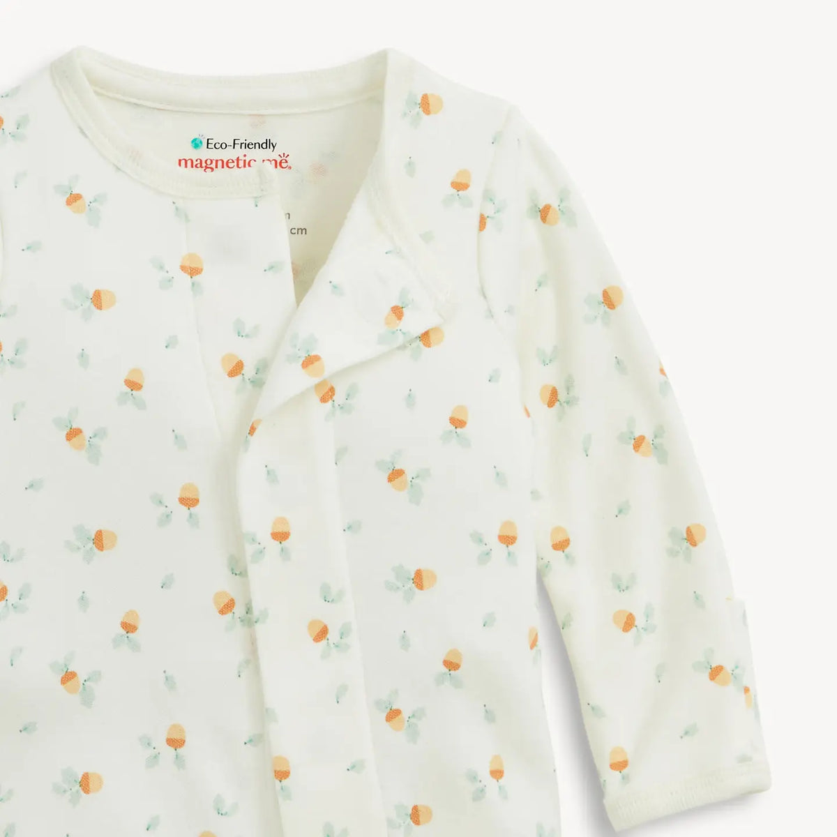 Baby onesie with fruit pattern on a white background