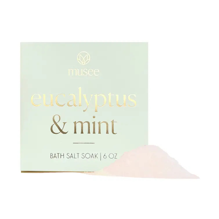 Bath salt soak packaging with 'eucalyptus & mint' text on a light green background