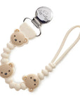 Baby pacifier clip with bear design on a white background
