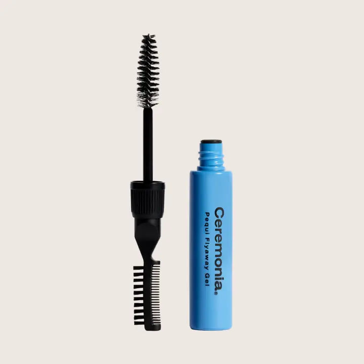 Ceremonla Pearl Flyaway Gel mascara shown with its applicator wand and open blue tube on a light beige background.