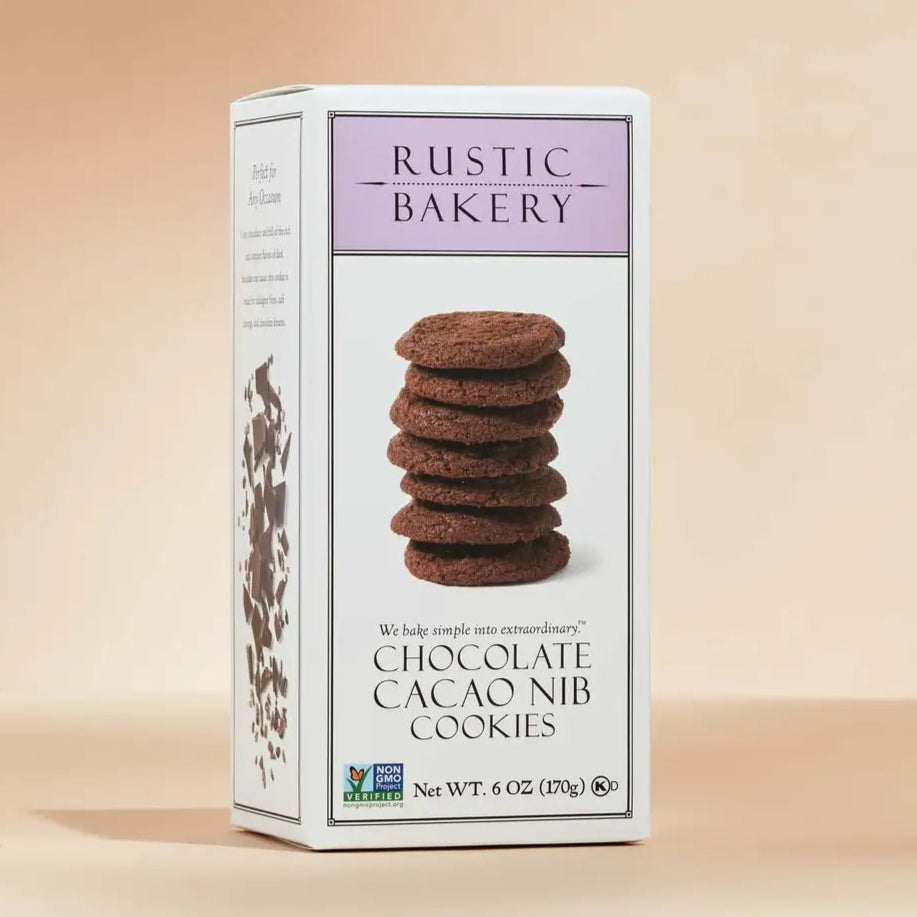 Box of Rustic Bakery chocolate cacao nib cookies on a beige background