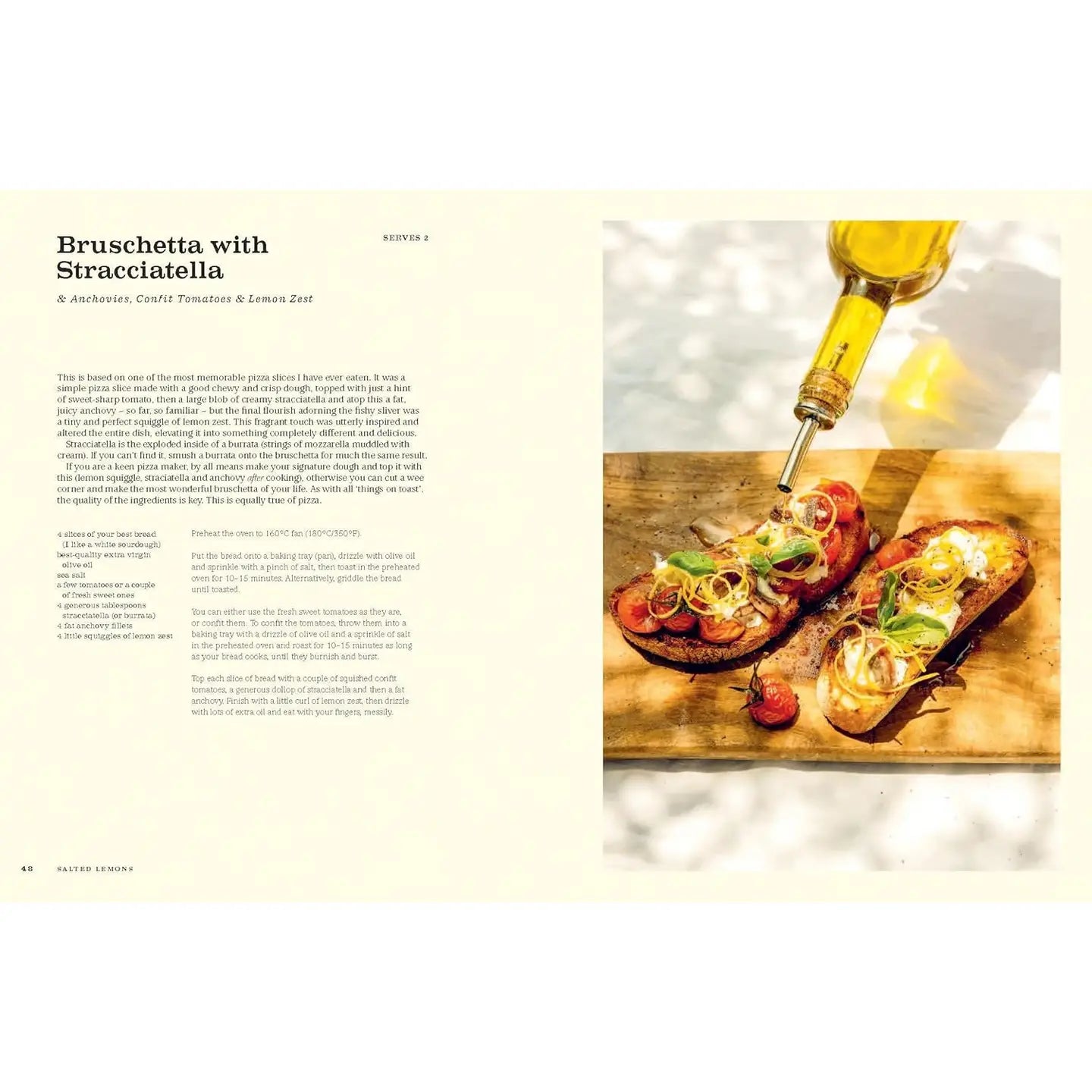 Bruschetta with Stracciatella on a wooden board with a bottle of olive oil.
