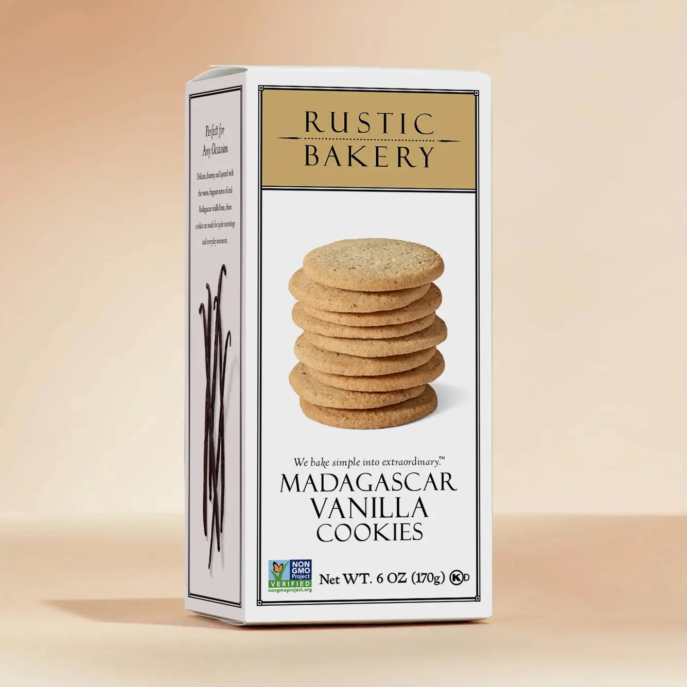 A box of Rustic Bakery Madagascar Vanilla Cookies, featuring a white front with a photo of stacked cookies and vanilla beans, set against a warm beige background.