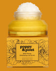 Jar of Poppy & Pout Wild Honey Exfoliating Lip Scrub on a mustard yellow background
