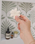 hand holding star-shaped shower steamer