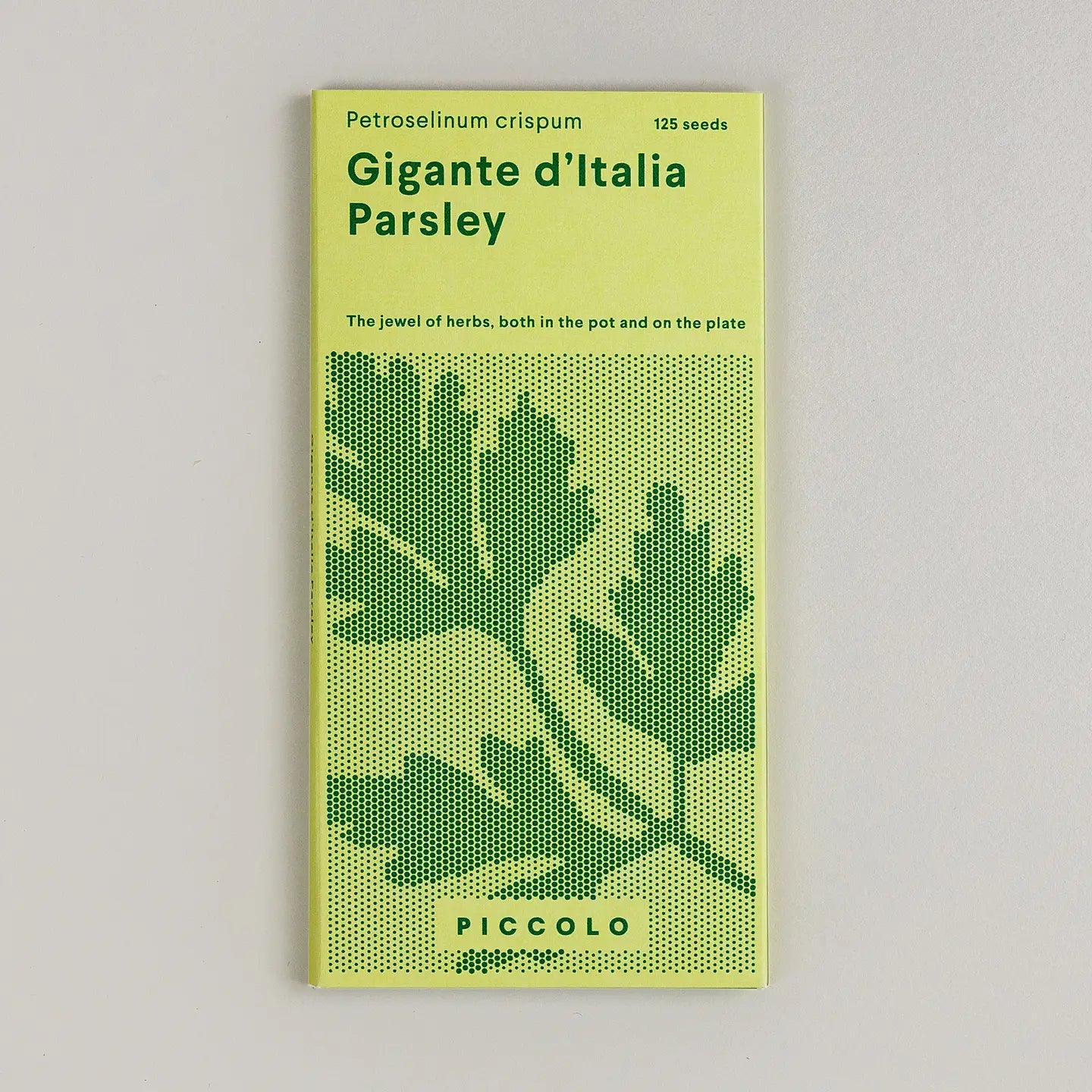 Seed packet for 'Gigante d'Italia Parsley' with green text and leaf design on a light gray background