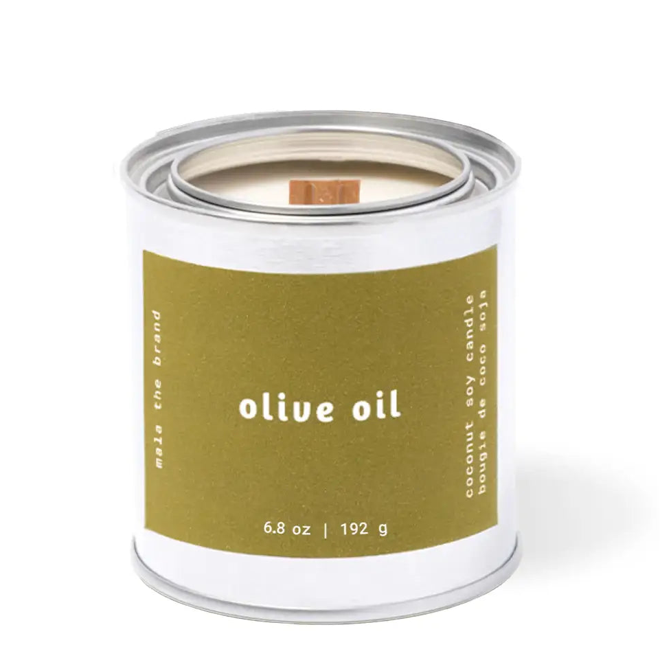 Candle in a tin labeled 'olive oil' on a white background