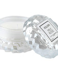 Crystal candle with 'VOLUSPA Milk Rose' label on a white background