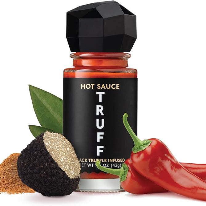 Hot sauce bottle labeled 'Truff' with truffle and chili pepper on a white background