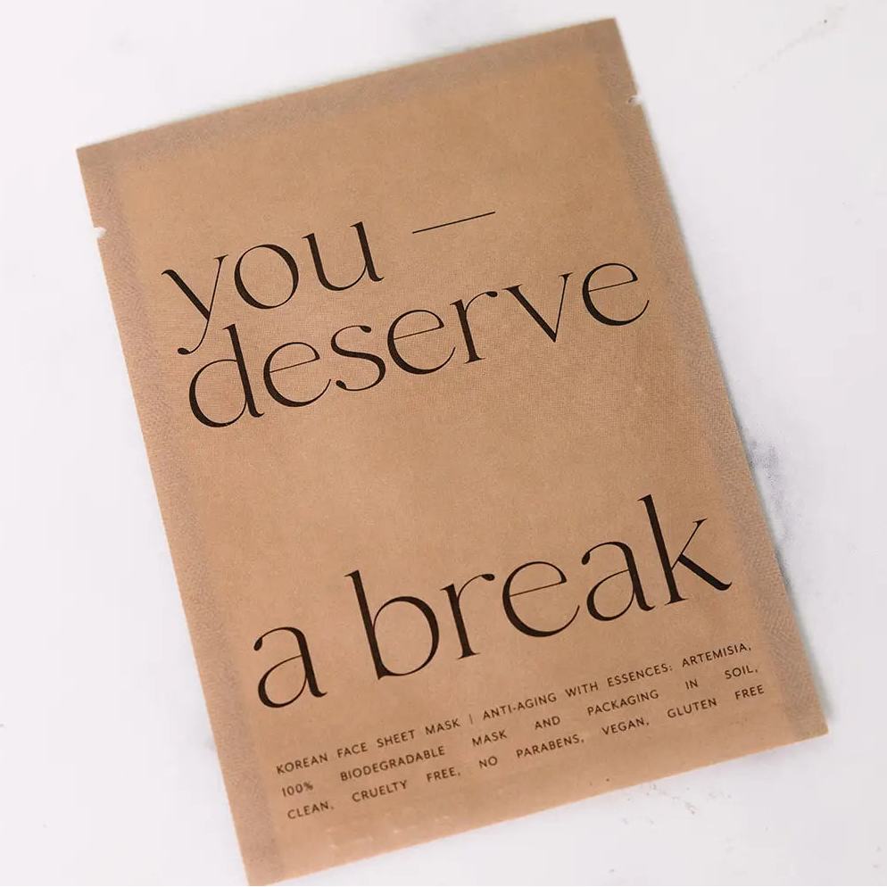 Kraft paper product packaging with 'you deserve a break' text on a white background