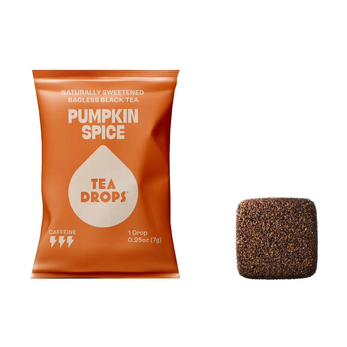 An orange bag of Tea Drops Pumpkin Spice naturally sweetened bagless black tea, shown next to a single square brown tea drop on a plain white background.