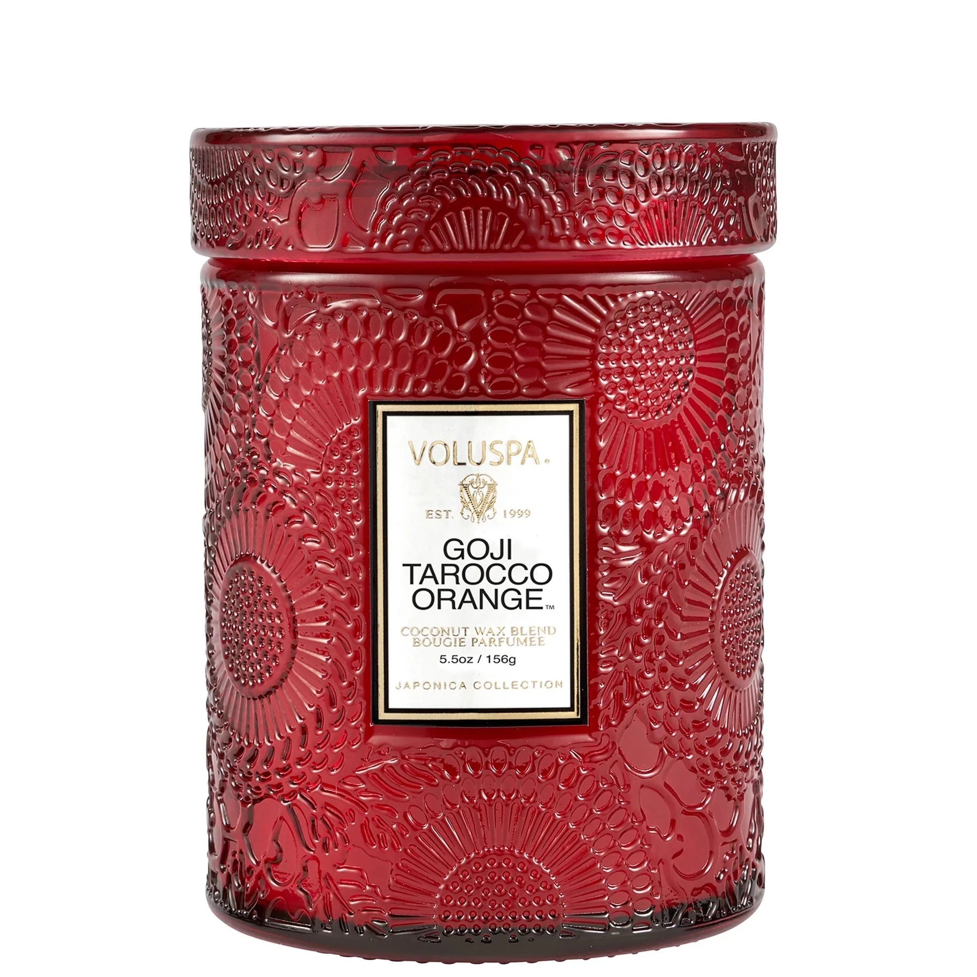 Red embossed glass candle. Embossed is a large floral print. Has white label with a black and gold border. Black text inside with scent name