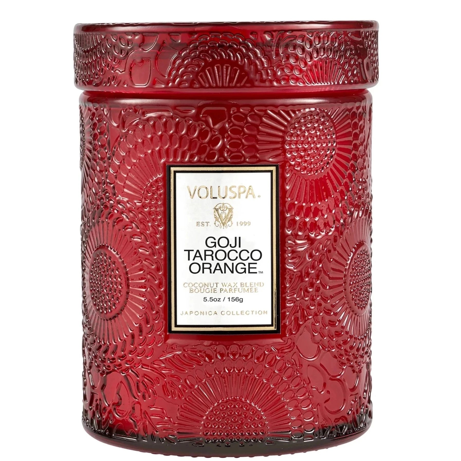 Red embossed glass candle. Embossed is a large floral print. Has white label with a black and gold border. Black text inside with scent name