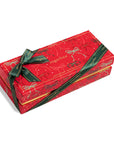 Red sugarpoin box with green ribbon on a white background